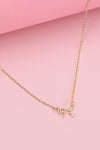 mini gold bow charm necklace