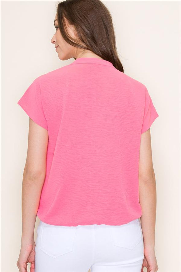 coral staccato wrap front elastic hem short sleeve blouse