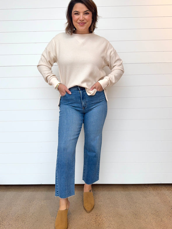 just black denim high rise medium wash straight leg jeans raw hem