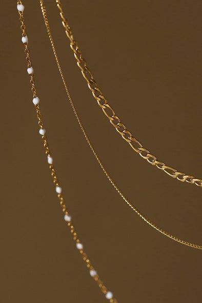 three layered 18K gold necklace pearl details