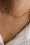 three layered 18K gold necklace pearl details