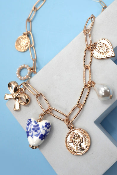 ceramic floral charm necklace paperclip chain multi charm gold plated