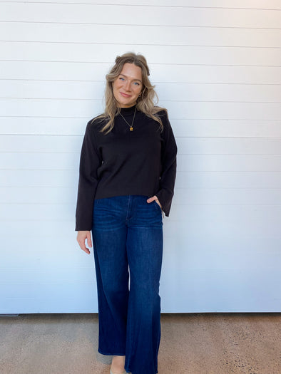 black mock neck sweater with bell sleeve