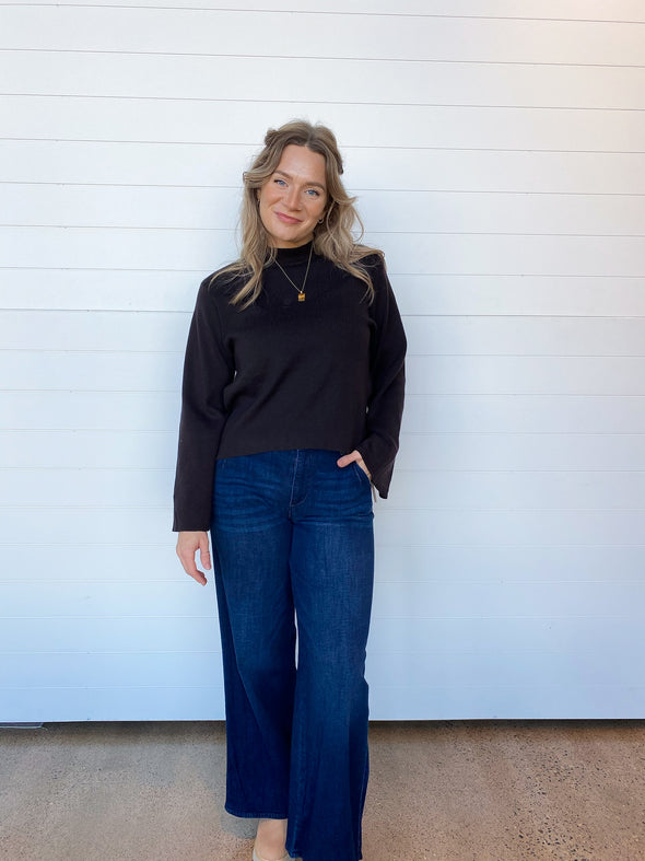 black mock neck sweater with bell sleeve
