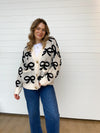 bow detail cardigan button down oversized chunky black and white holiday