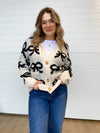 The Lydia Bow Pattern Button Down Cardigan
