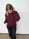 burgundy crew neck sweater with rolled edge detailing