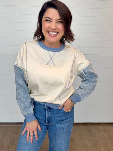 cream knit pullover sweatshirt with denim neckline sleeves and cuffs