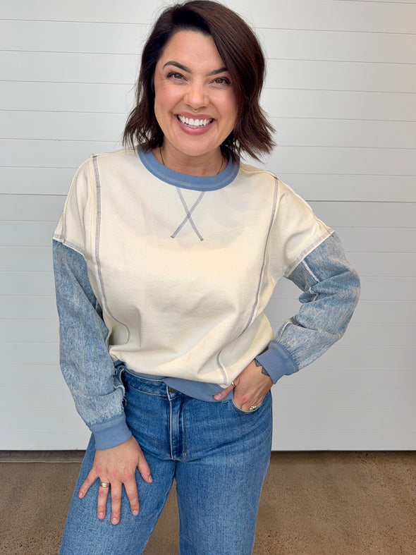 cream knit pullover sweatshirt with denim neckline sleeves and cuffs
