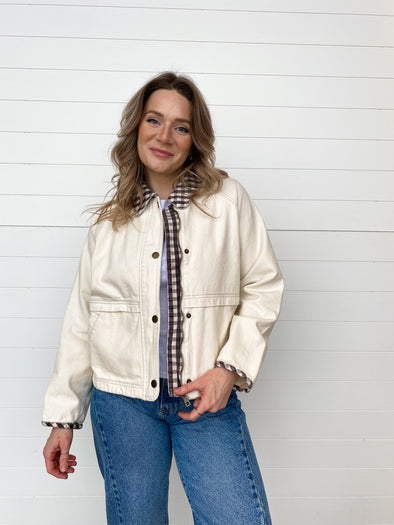 cream jacket with chocolate brown gingham collar and trim