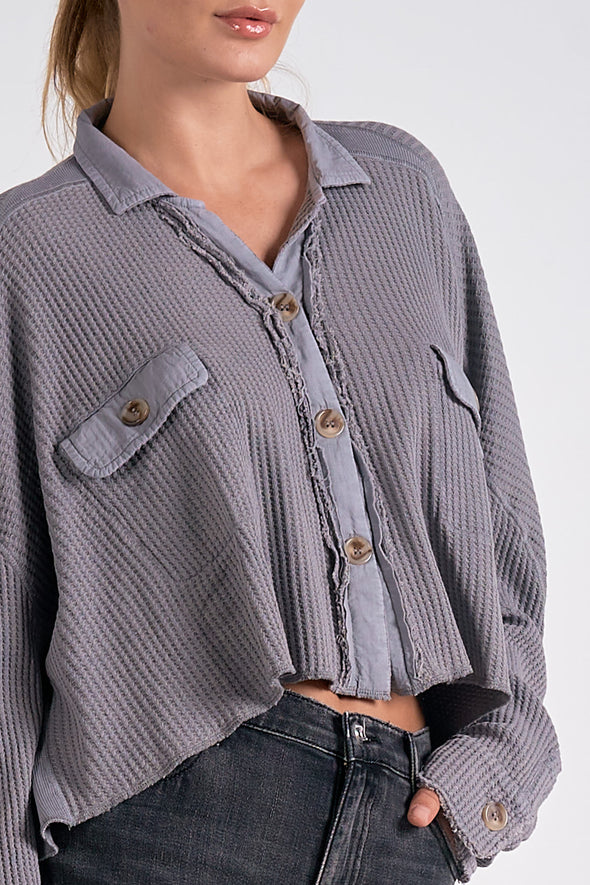 cropped waffle knit button up shacket exposed seams chest pockets dark grey