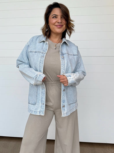  light blue denim jacket over a beige Z Supply set